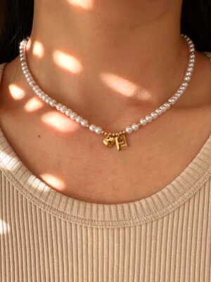 Collier perles avec médaillon « Good Luck » en acier inoxydable